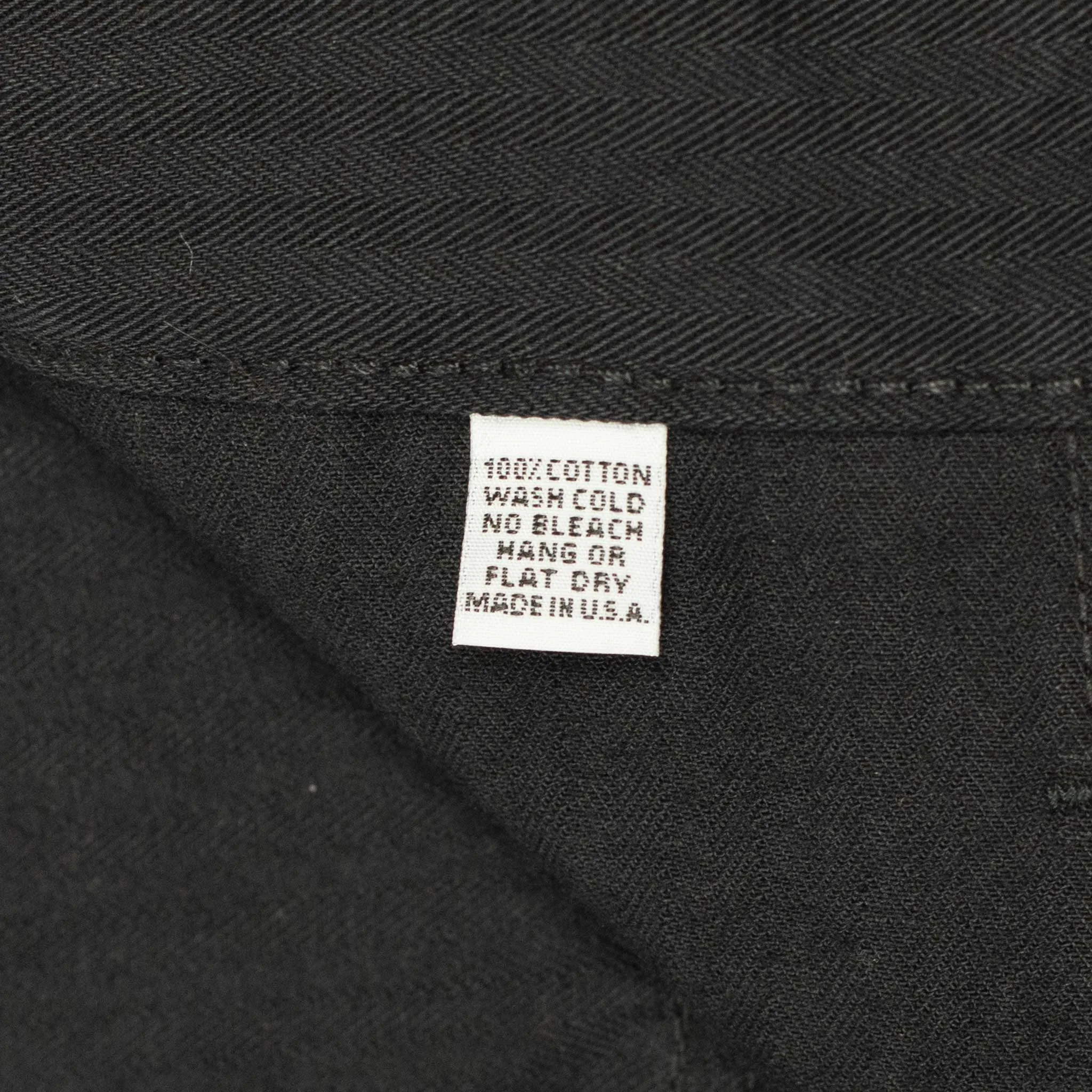 Fatigue pants in washed black herringbone cotton